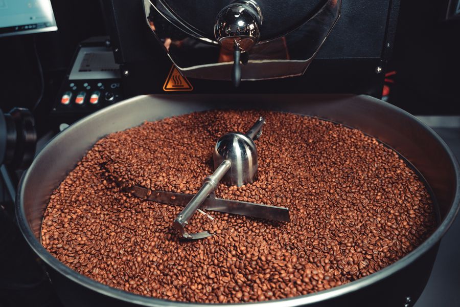 Freshly roasted coffee beans cooling in the roaster