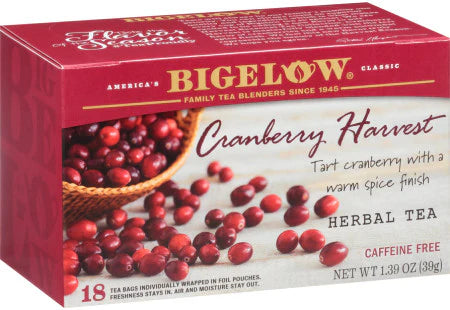 Bigelow Cranberry Harvest herbal tea box with loose cranberries scattered beside it
