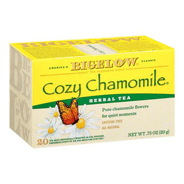 Bigelow Cozy Chamomile herbal tea box with warm, calming chamomile-inspired colors and 20 wrapped tea bags on white background.